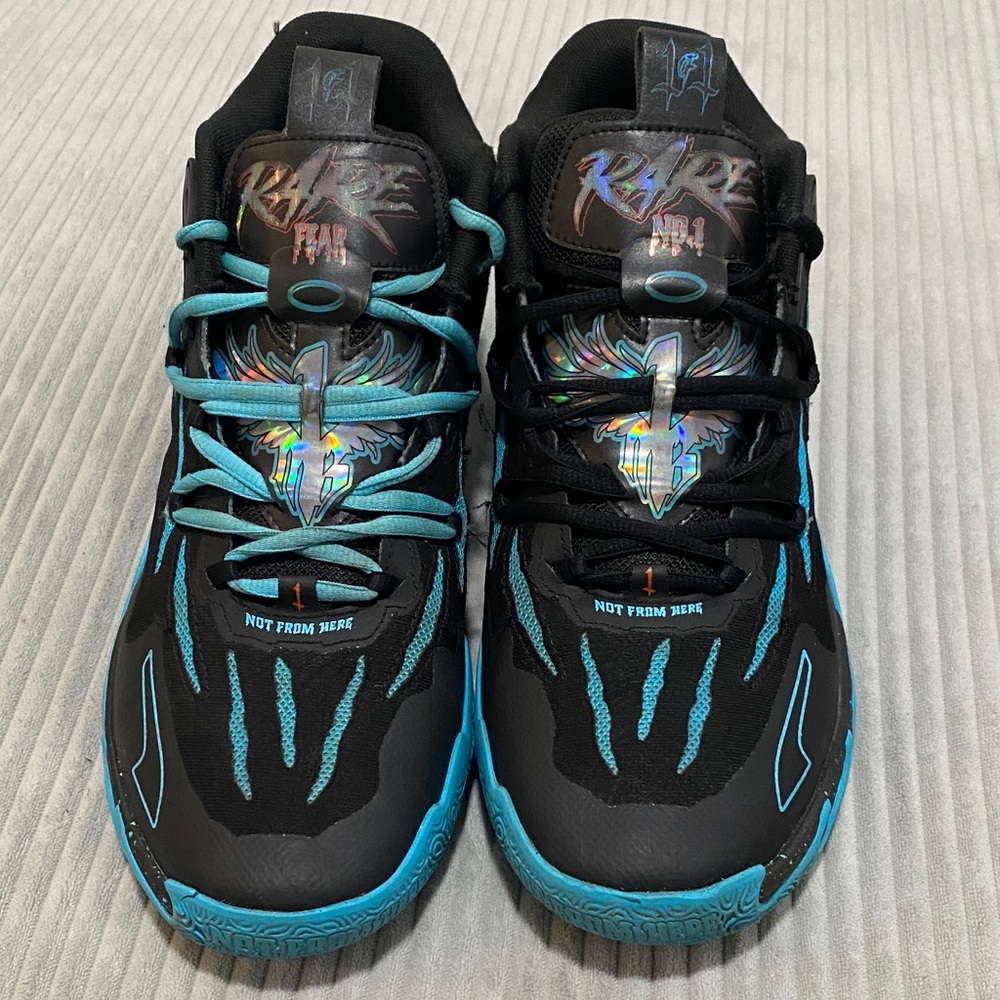 Men’s PUMA size 11 Black with Aqua Blue Claw marks basketball Sneakers.